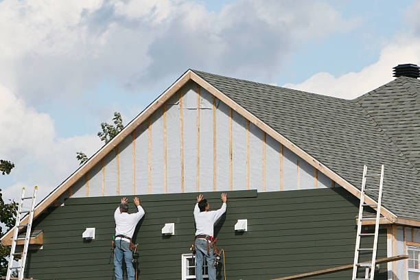 Professional Storm Damage Siding Repair technician working in Weems, VA
